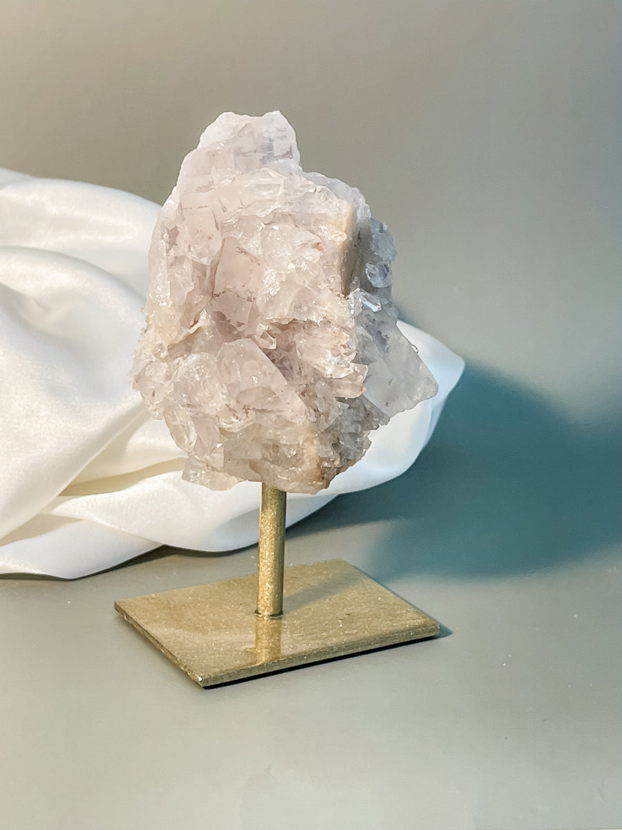 clear quartz cluster on stand